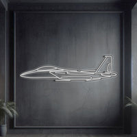F‑15 Strike Eagle angled neon silhouette wall art, laser‑cut steel with glowing neon outline and bold 3D elevation